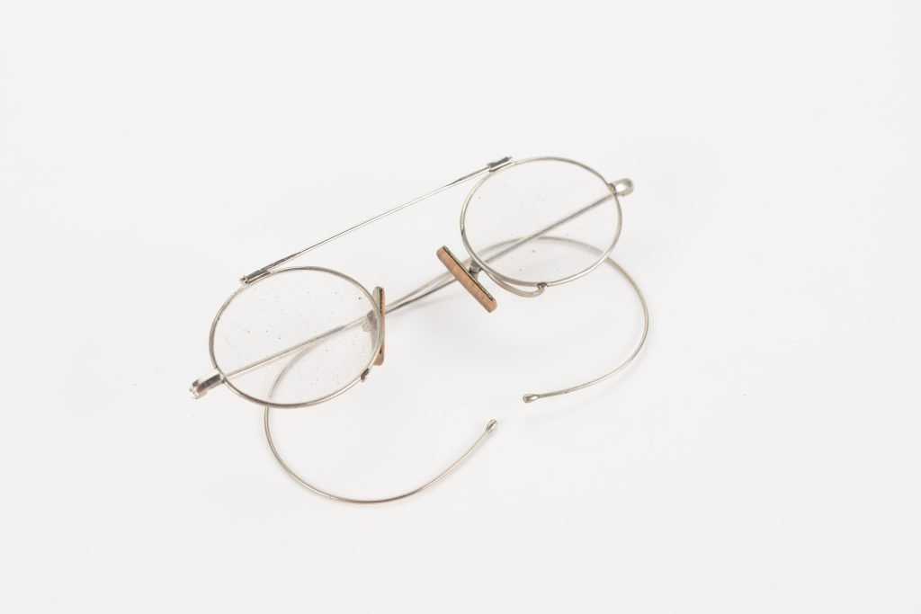 Round wire-frame metal eyeglasses on a white background
